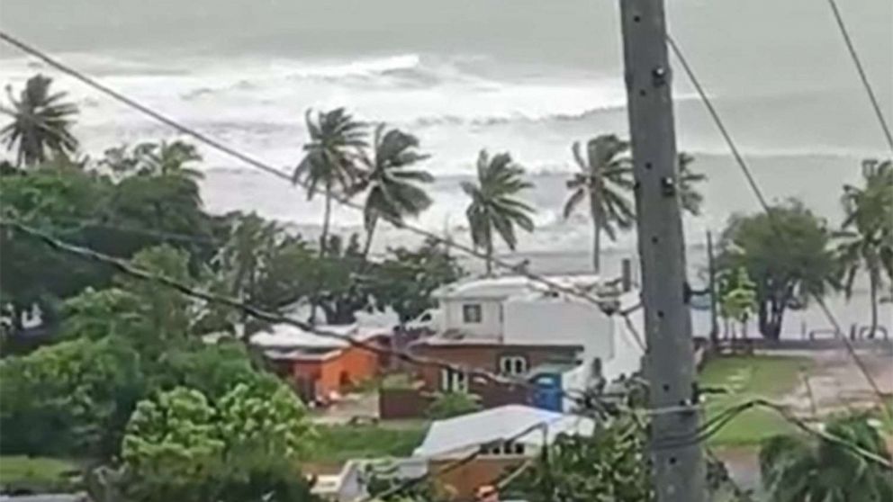 PHOTO: Tide churns and trees sway in the wind as residents hunker down during Tropical Storm Fiona in Recio, Patillas, Puerto Rico, Sept. 18, 2022. 
