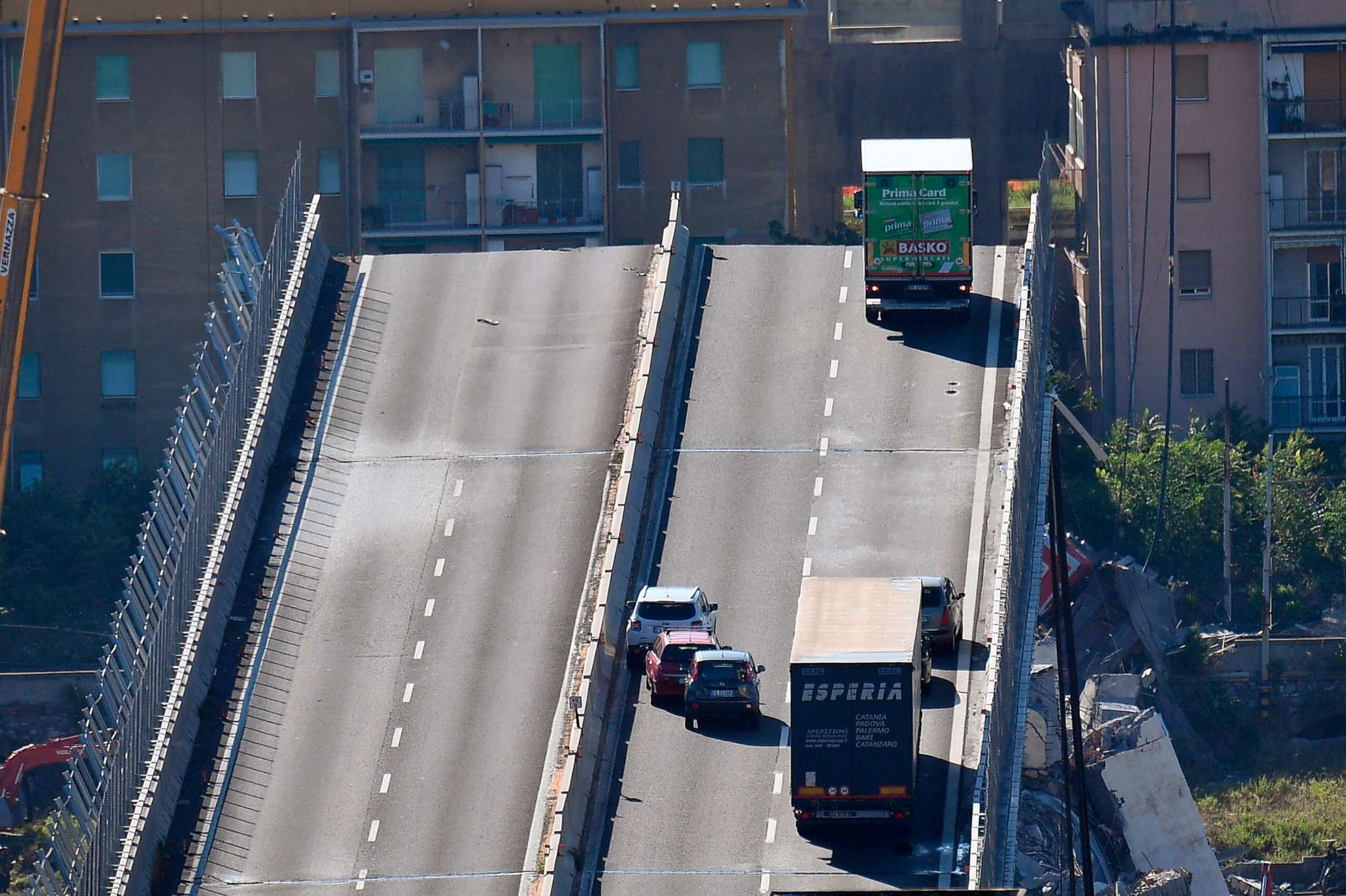 PHOTO: A truck is stopped at the end of the collapsed Morandi highway bridge in Genoa, northern Italy, Aug. 15, 2018. A bridge on a main highway collapsed during a sudden, violent storm, sending vehicles plunging nearly 300 feet.