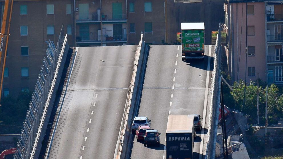 PHOTO: A truck is stopped at the end of the collapsed Morandi highway bridge in Genoa, northern Italy, Aug. 15, 2018. A bridge on a main highway collapsed during a sudden, violent storm, sending vehicles plunging nearly 300 feet.