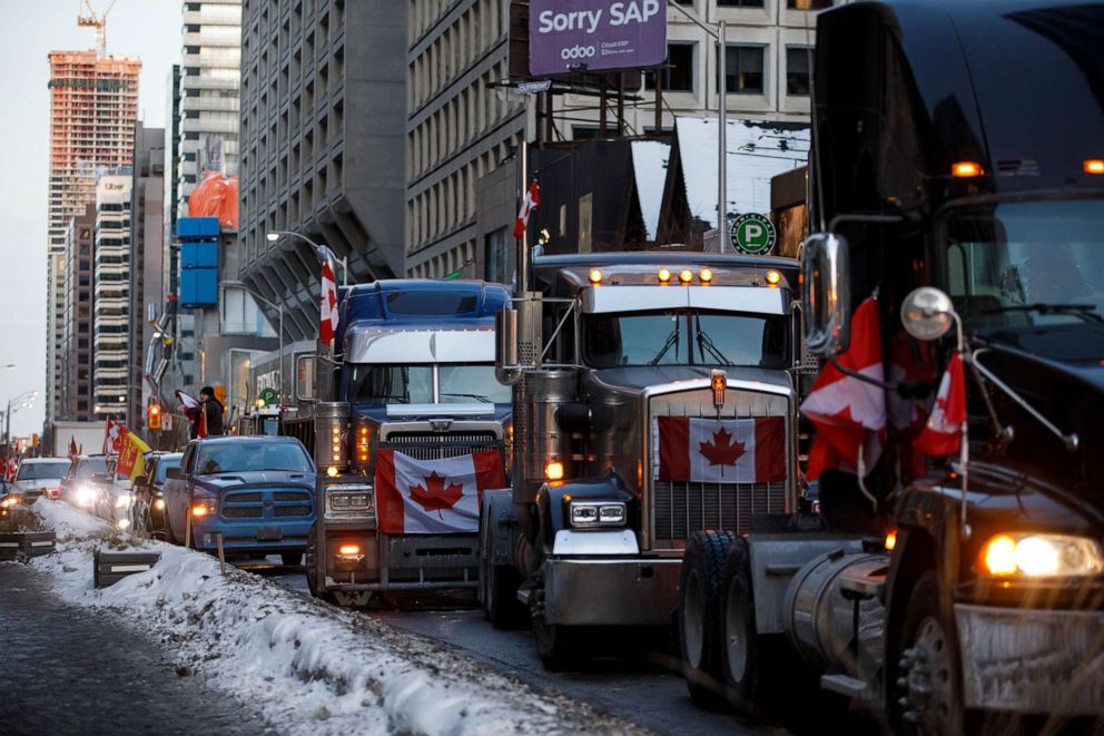 PHOTO: Trucks line Bloor Street near the Yorkville neighborhood in Toronto, Ontario province, Canada, Feb. 5, 2022.