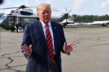 PHOTO: US President Donald Trump speaks to the press before boarding Air Force One in Morristown, New Jersey, on August 18, 2019.