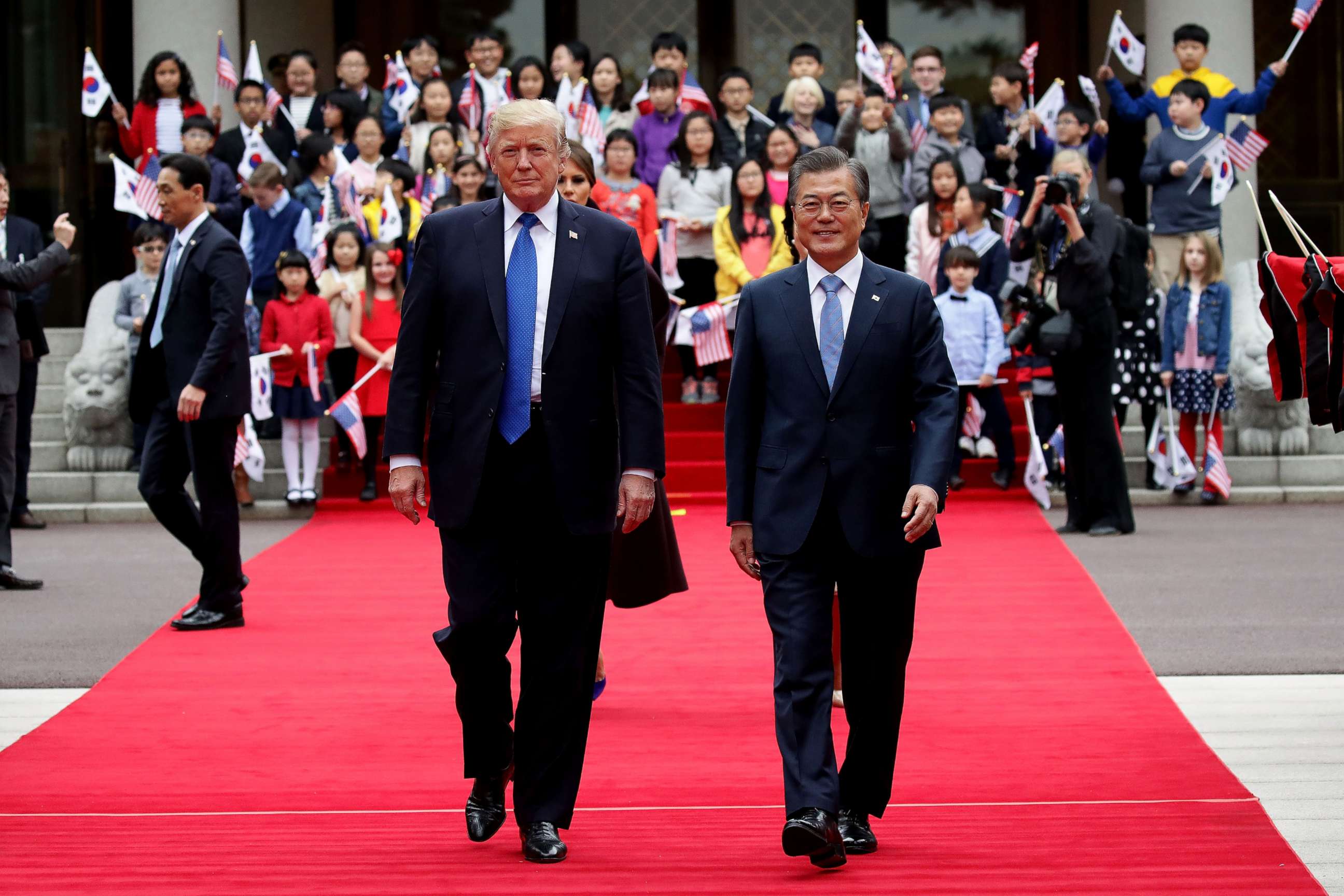 PHOTO: South Korean President Moon Jae-In and  President Donald Trump walk towards a guard of honor during a welcoming ceremony at the presidential Blue House, Nov. 7, 2017, in Seoul, South Korea. 