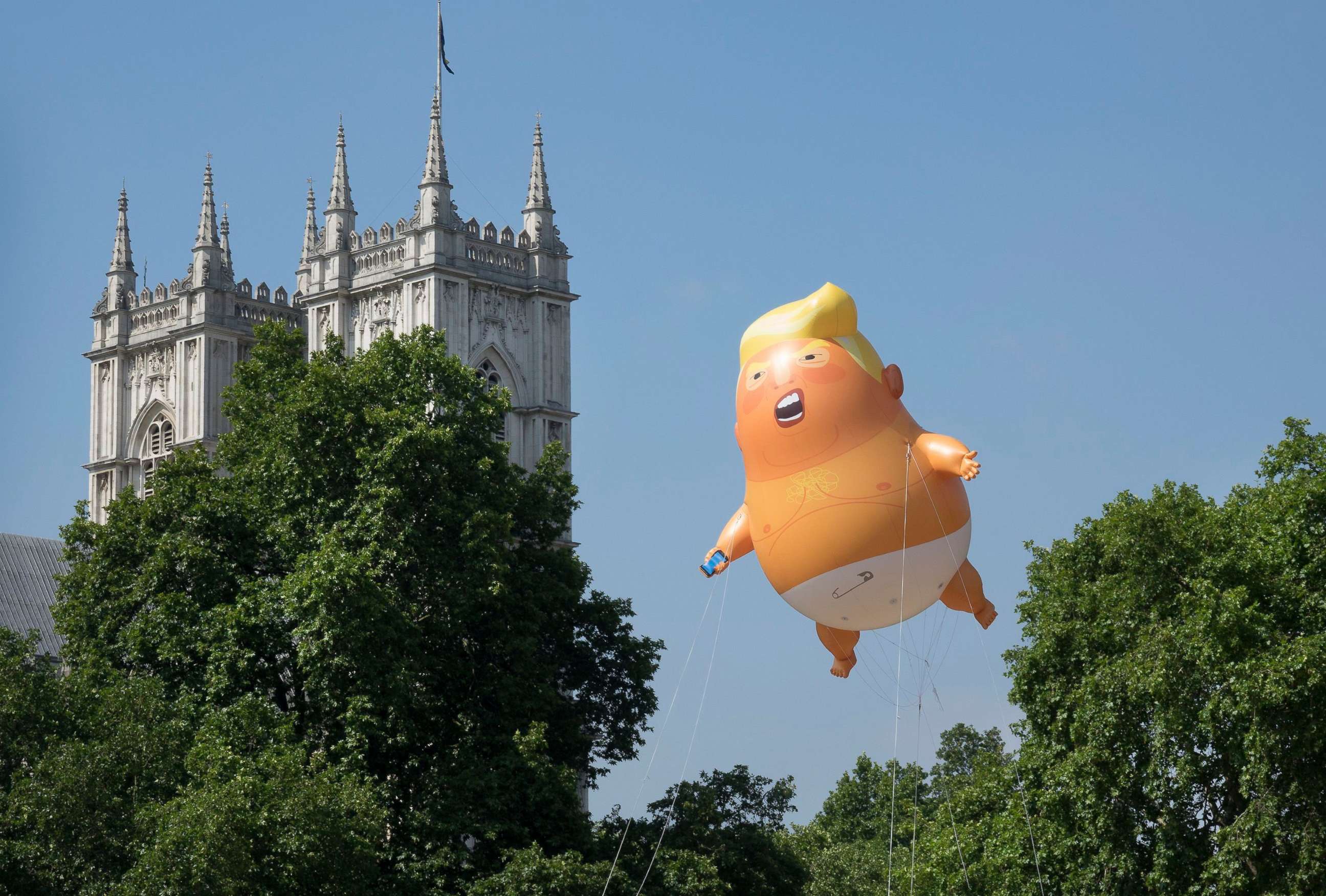 PHOTO: A giant inflatable balloon depicting President Trump as a baby in a nappy is flown over Parliament Square in London, July 13, 2018.