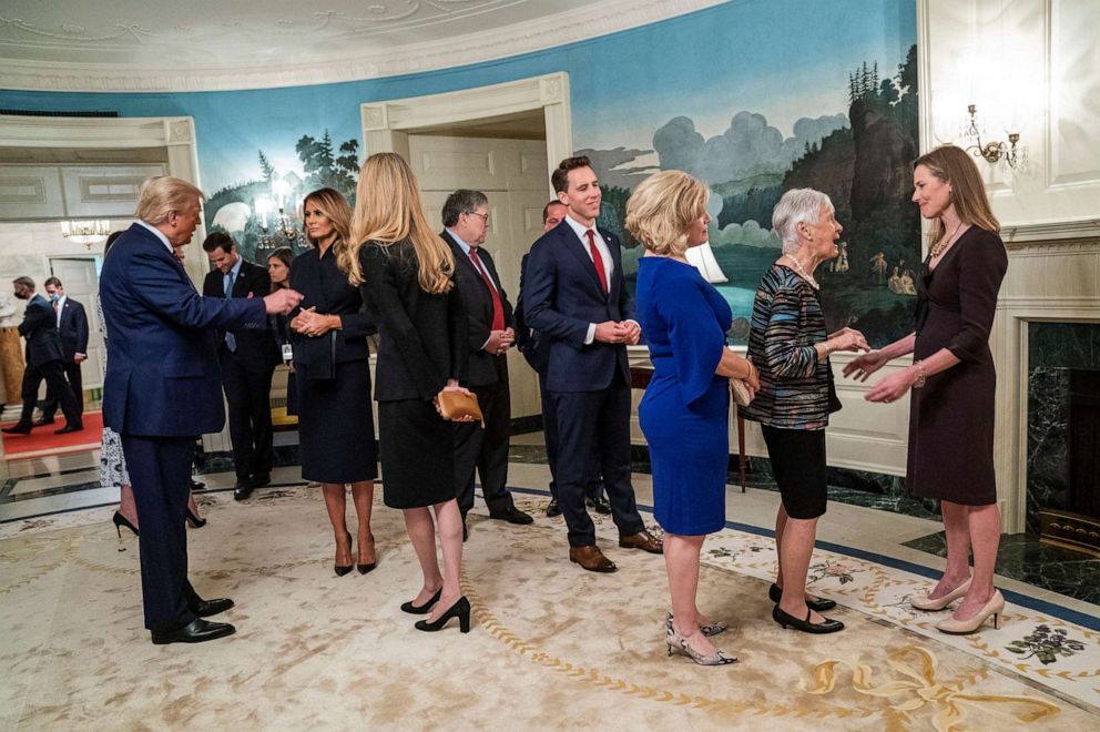 President Donald Trump, left, and Judge Amy Coney Barrett, right, his Supreme Court nominee, in the Diplomatic Room of the White House in Washington, prior to making the announcement of Barrett's nomination in the Rose Garden, on Saturday, Sept. 26, 2020.