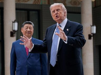 President Donald Trump and Chinese President Xi Jinping shake hands during a meeting.