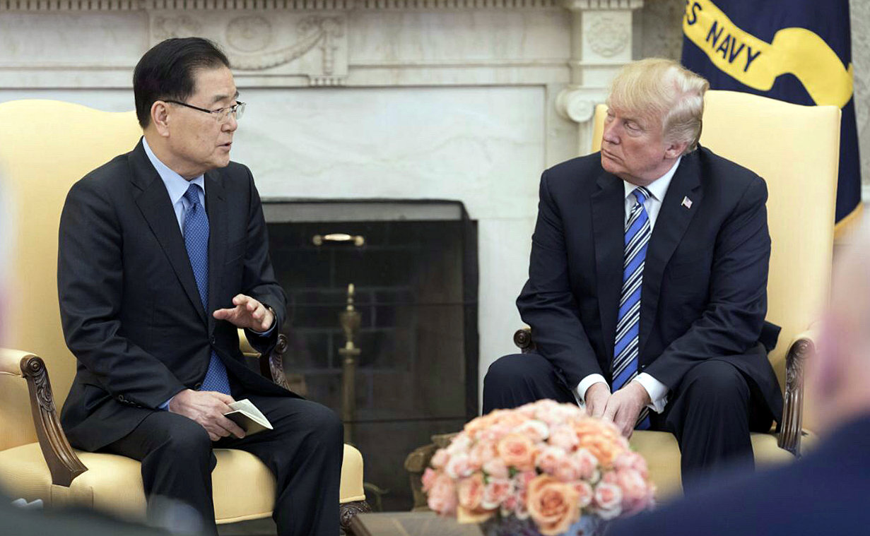 PHOTO: Chung Eui-yong, South Korea's national security chief, briefs President Donald Trump at the Oval Office about his visit to North Korea, in Washington. D.C., March 8, 2018.