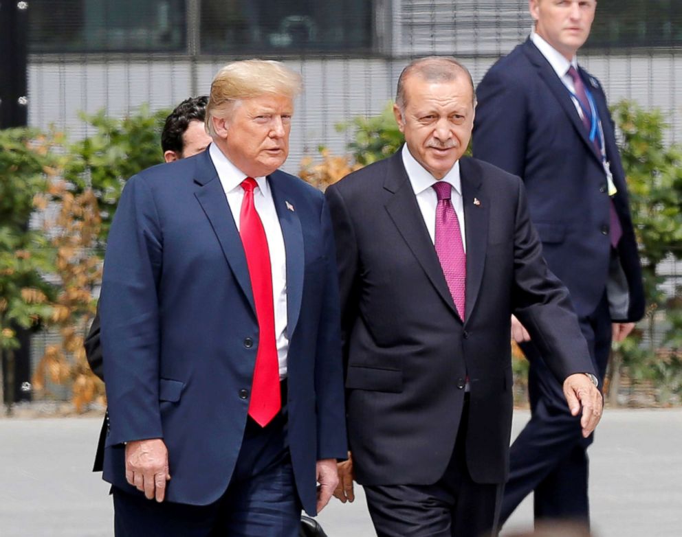 PHOTO: Turkish President Recep Tayyip Erdogan, right, and President Donald Trump speak to each other during the 2018 NATO Summit at NATO headquarters, July 11, 2018, in Brussels, Belgium.