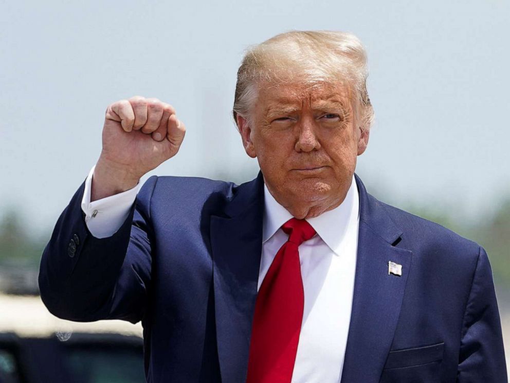 PHOTO: President Donald Trump pumps his fist as he arrives at Miami International Airport in Miami, July 10, 2020.