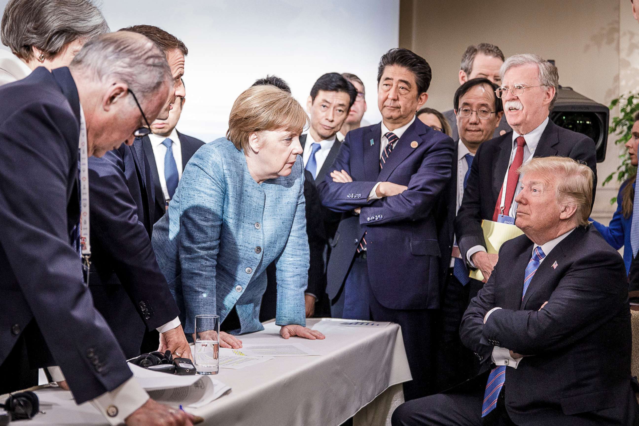 PHOTO: German Chancellor Angela Merkel speaks with President Donald Trump on the sidelines of the official agenda of the G7 summit on June 9, 2018, in Charlevoix, Canada.