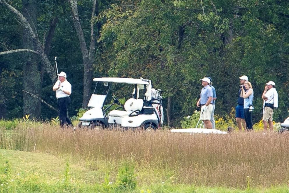 PHOTO: President Donald Trump swings during a round of golf at the Trump National Golf Club in Sterling, Va., Sept. 27, 2020.