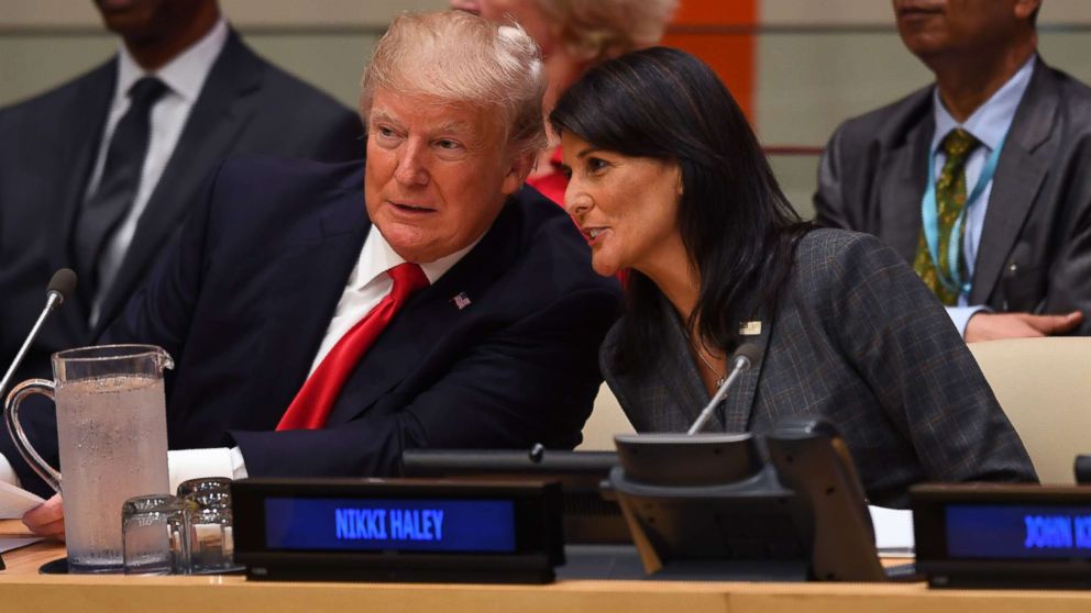 President Donald Trump and US ambassador to the United Nations Nikki Haley speak during a meeting on United Nations Reform at the United Nations headquarters on September 18, 2017, in New York.