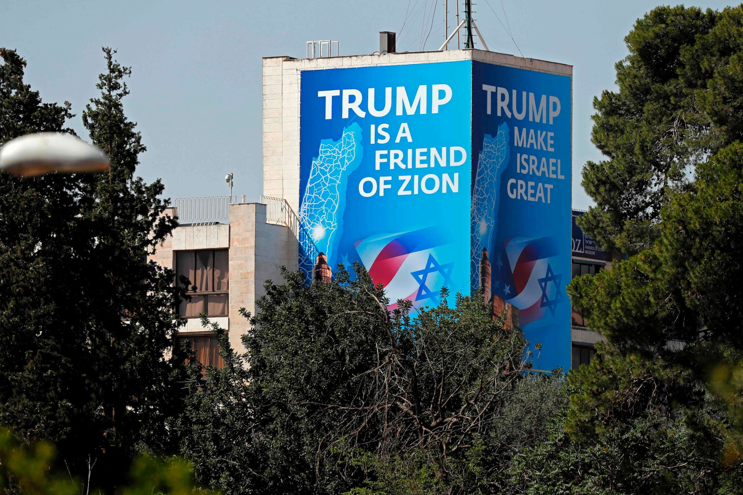 PHOTO: A poster praising President Donald Trump covers an outside section of the "Diplomat Hotel," adjacent to the US consulate in Jerusalem which will host the new US embassy, May 11, 2018.
