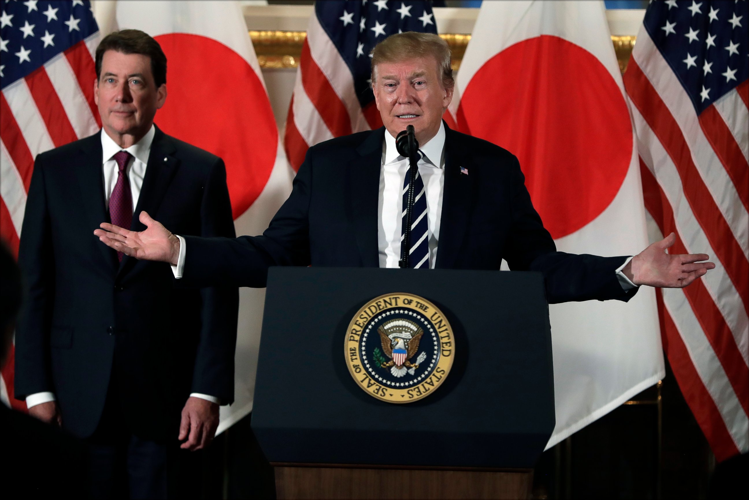 PHOTO: President Donald Trump speaks with Japanese business leaders, Saturday, May 25, 2019, in Tokyo, as U.S. Ambassador to Japan William Hagerty listens.