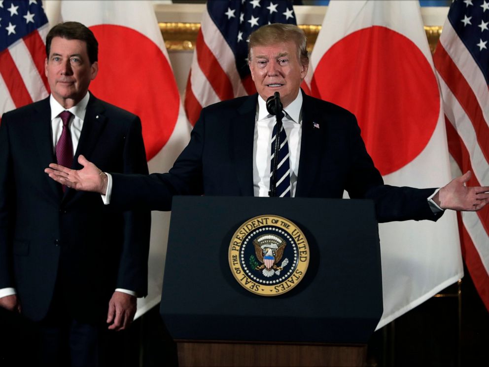 PHOTO: President Donald Trump speaks with Japanese business leaders, Saturday, May 25, 2019, in Tokyo, as U.S. Ambassador to Japan William Hagerty listens.