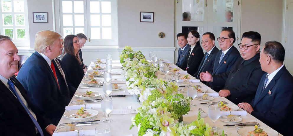PHOTO: North Korea's leader Kim Jong Un (4th R) and President Donald Trump (3rd L) attend a working lunch with their respective delegations at their historic US-North Korea summit, at the Capella Hotel on Sentosa island, June 12, 2018, in Singapore.