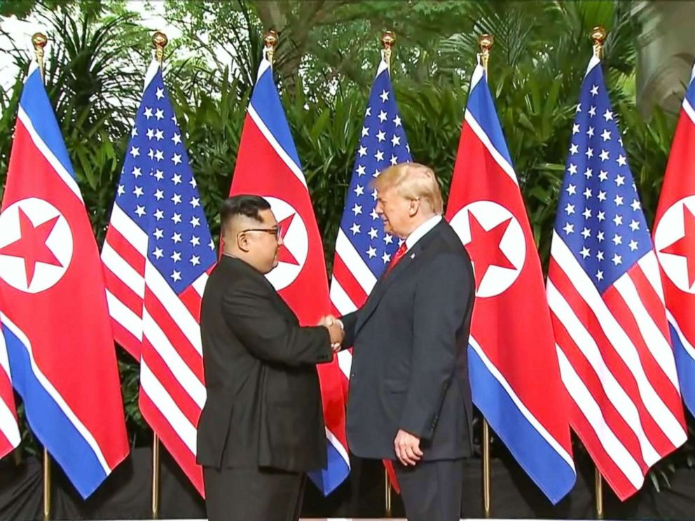 PHOTO: President Donald Trump and North Korean leader Kim Jong Un pose together ahead of their meeting at Capella Hotel in Singapore, on June 12, 2018.