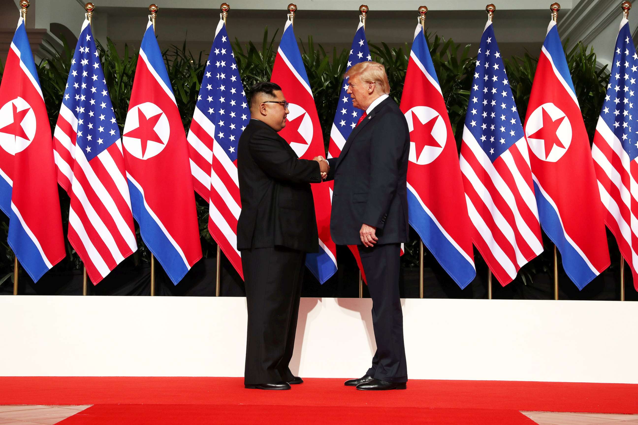 PHOTO: President Donald Trump shakes hands with North Korean leader Kim Jong Un at the Capella Hotel on Sentosa island in Singapore, June 12, 2018.