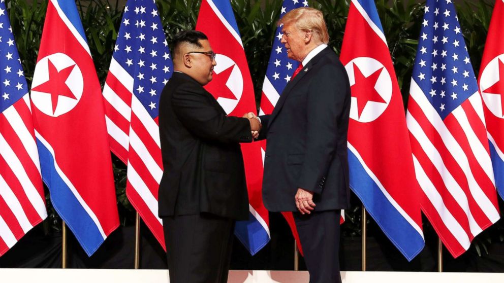 PHOTO: President Donald Trump shakes hands with North Korean leader Kim Jong Un at the Capella Hotel on Sentosa island in Singapore, June 12, 2018.