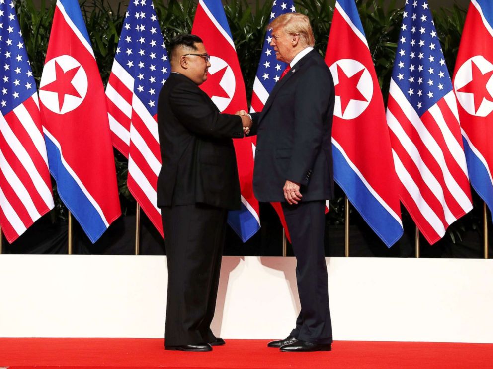 PHOTO: President Donald Trump shakes hands with North Korean leader Kim Jong Un at the Capella Hotel on Sentosa island in Singapore, June 12, 2018.