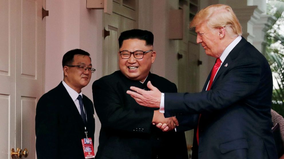 President Donald Trump shakes hands with North Korea's leader Kim Jong Un at the Capella Hotel on Sentosa island in Singapore on June 12, 2018.