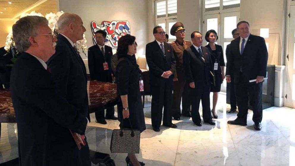 National Security Advisor John Bolton, White House Chief of Staff John F. Kelly, and Secretary of State Mike Pompeo stand with North Korean dignitaries in a photo shared on Twitter by White House Press Secretary Sarah Sanders, June 11, 2018.