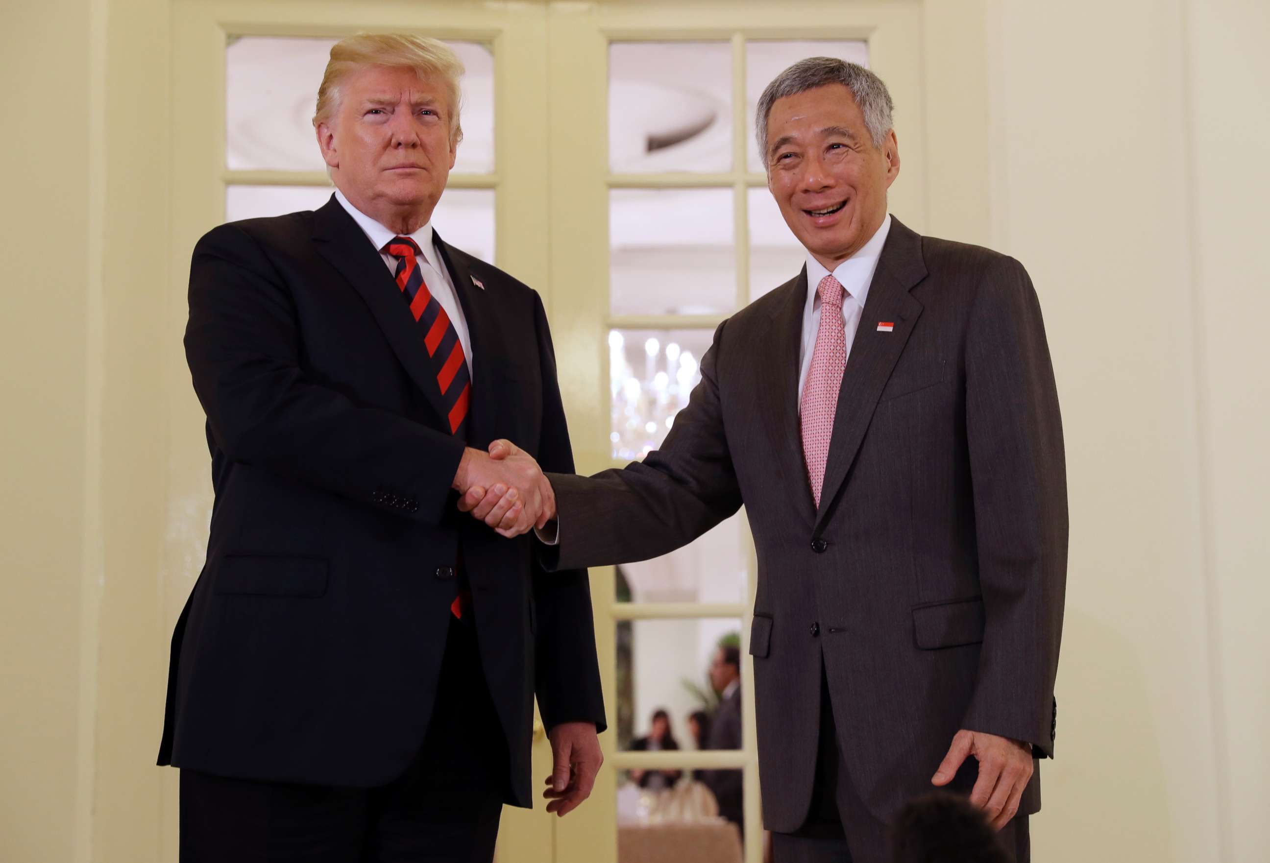 PHOTO: President Donald Trump shakes hands with Singapore Prime Minister Lee Hsien Loong ahead of a summit with North Korean leader Kim Jong Un, June 11, 2018, in Singapore.