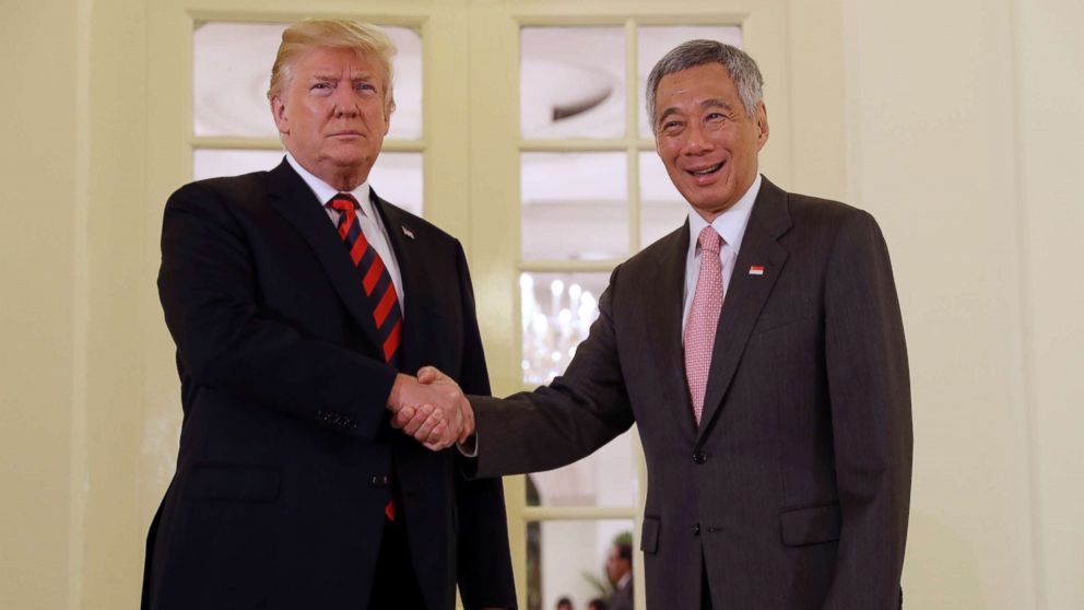 President Donald Trump shakes hands with Singapore Prime Minister Lee Hsien Loong ahead of a summit with North Korean leader Kim Jong Un, June 11, 2018, in Singapore.