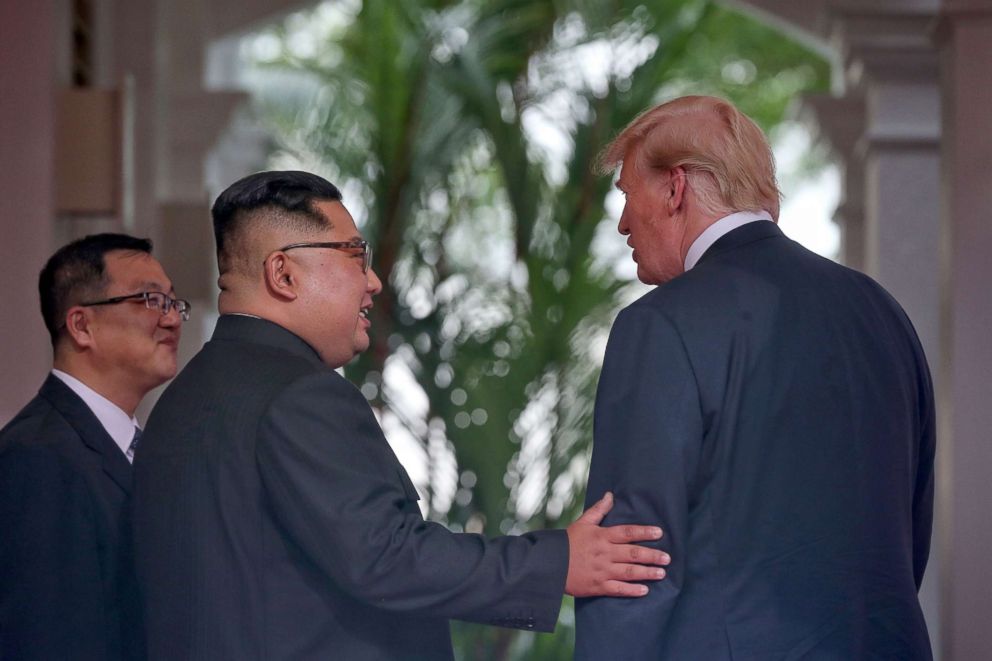 PHOTO: North Korea's leader Kim Jong Un speaks with President Donald Trump as they meet for a historic summit at the Capella Hotel on Sentosa island in Singapore, June 12, 2018.