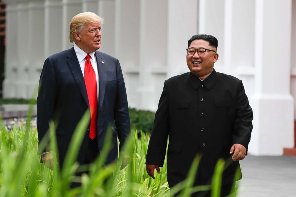 PHOTO: President Donald Trump and North Korea leader Kim Jong Un walk from their lunch at the Capella resort on Sentosa Island on June 12, 2018 in Singapore.