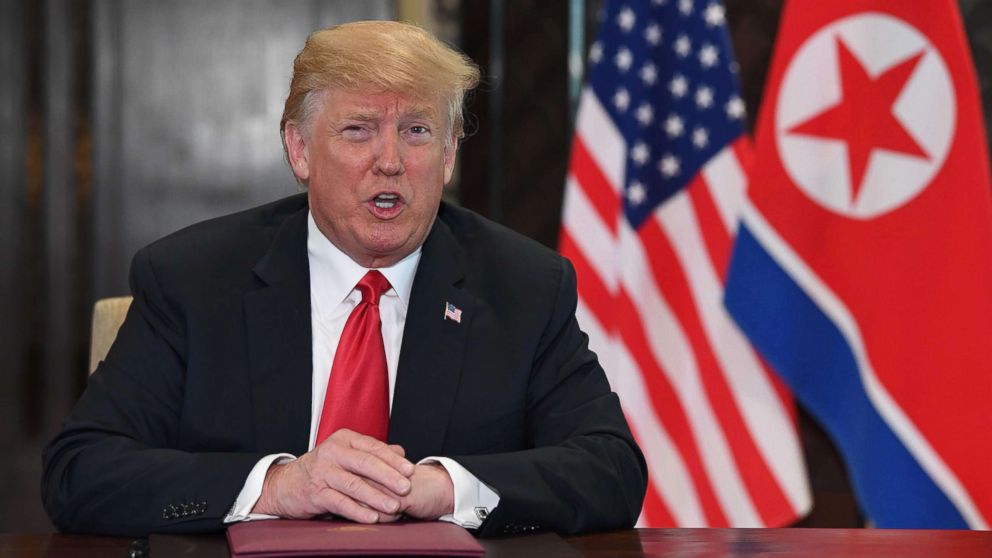 US President Donald Trump speaks at a signing ceremony with North Korea's leader Kim Jong Un during their historic summit, at the Capella Hotel on Sentosa island in Singapore on June 12, 2018.