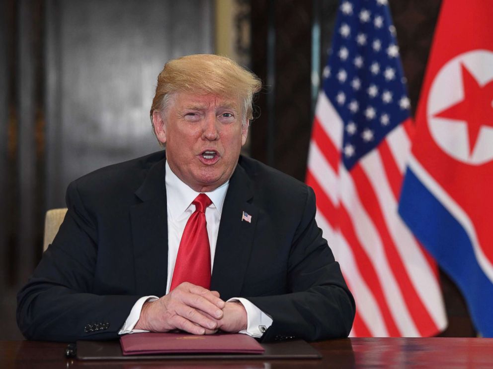 PHOTO: US President Donald Trump speaks at a signing ceremony with North Koreas leader Kim Jong Un during their historic summit, at the Capella Hotel on Sentosa island in Singapore on June 12, 2018.