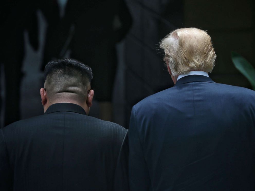 PHOTO: North Korean leader Kim Jong-un and President Donald Trump are pictured during their summit at the Capella Hotel on Sentosa island on June 12, 2018 in Singapore.