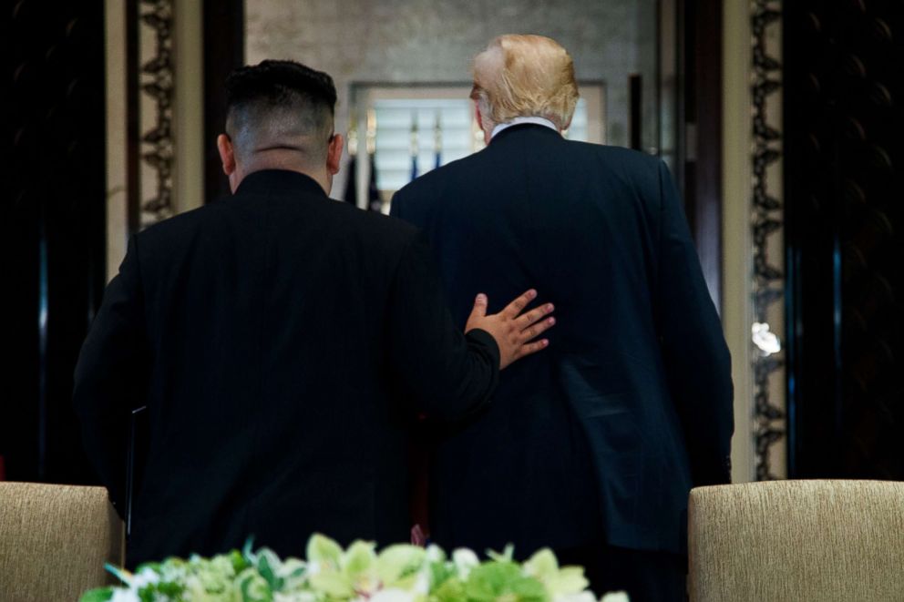 PHOTO: President Donald Trump and North Korean leader Kim Jong Un walk off after a signing ceremony during a meeting on Sentosa Island on June 12, 2018 in Singapore.