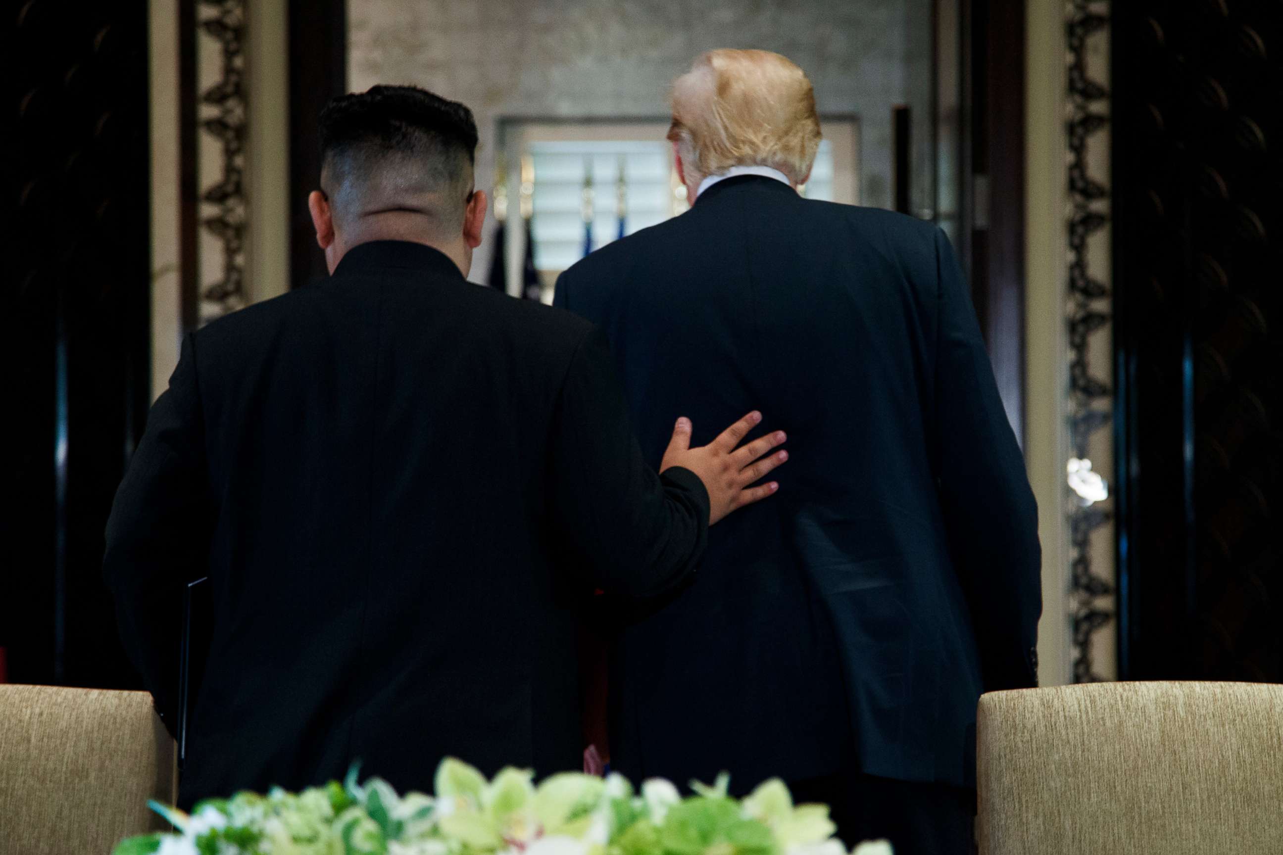 PHOTO: President Donald Trump and North Korean leader Kim Jong Un walk off after a signing ceremony during a meeting on Sentosa Island, June 12, 2018, in Singapore.