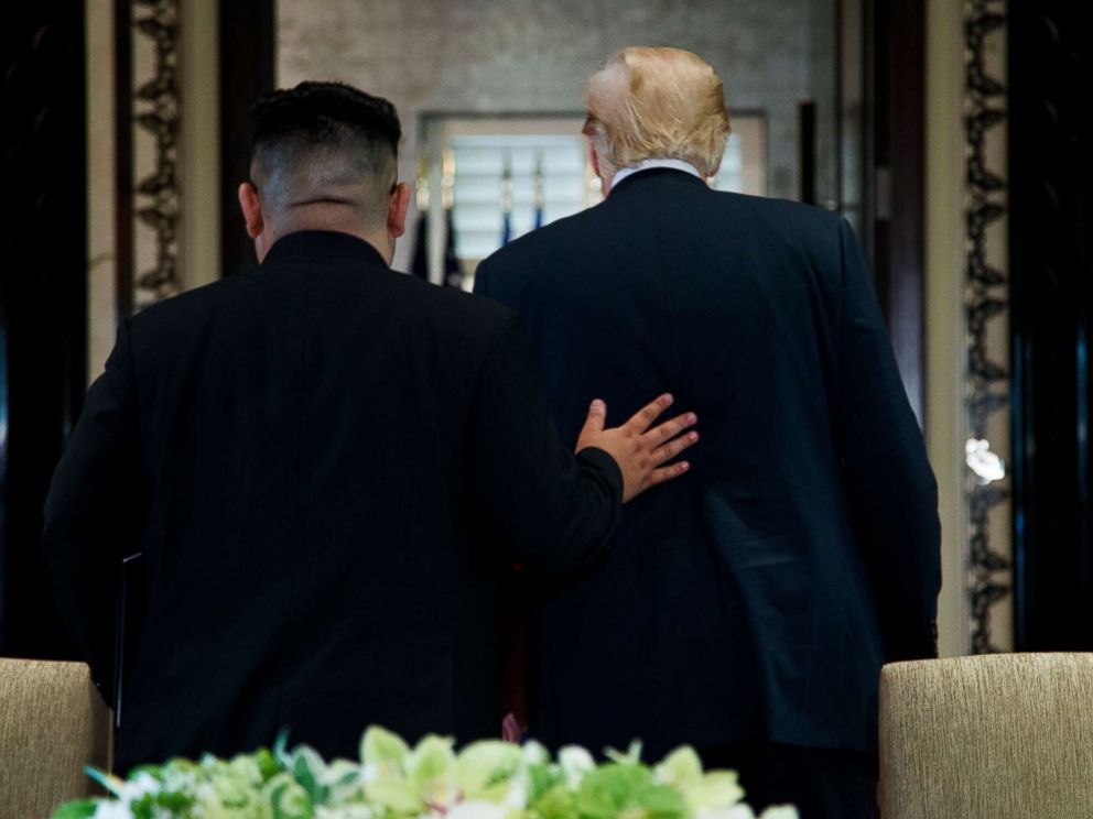 PHOTO: President Donald Trump and North Korean leader Kim Jong Un walk off after a signing ceremony during a meeting on Sentosa Island, June 12, 2018, in Singapore.
