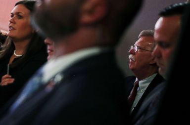 PHOTO: National Security Advisor John Bolton and White House spokeswoman Sarah Sanders listen as President Trump speaks after his meeting with North Korean leader Kim Jong Un at the Capella Hotel on Sentosa island in Singapore, June 12, 2018.