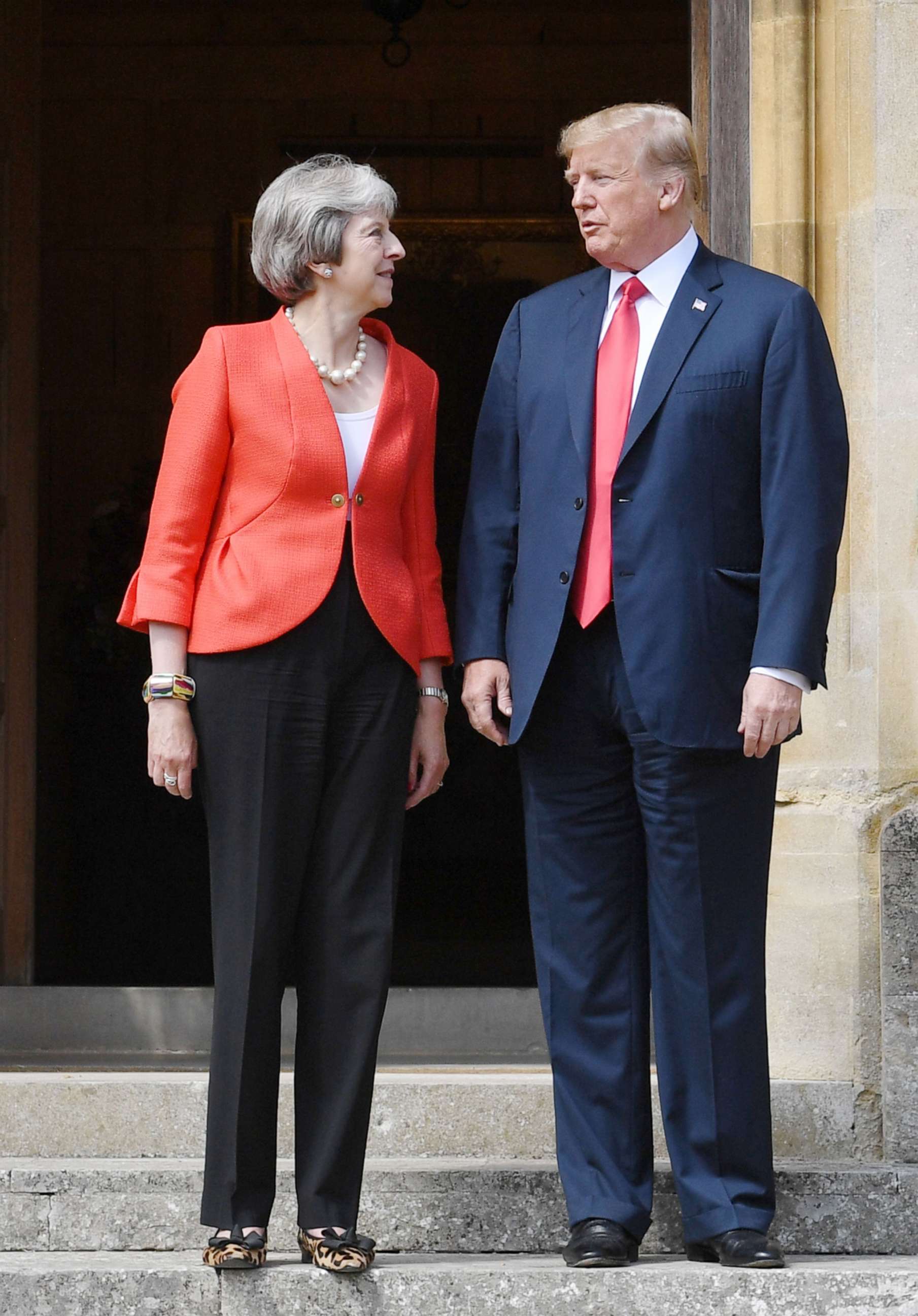 PHOTO: President Donald Trump and Britain's Prime Minister Theresa May stand together upon Trump's arrival for a meeting at Chequers, the prime minister's country residence, near Ellesborough, northwest of London, July 13, 2018.