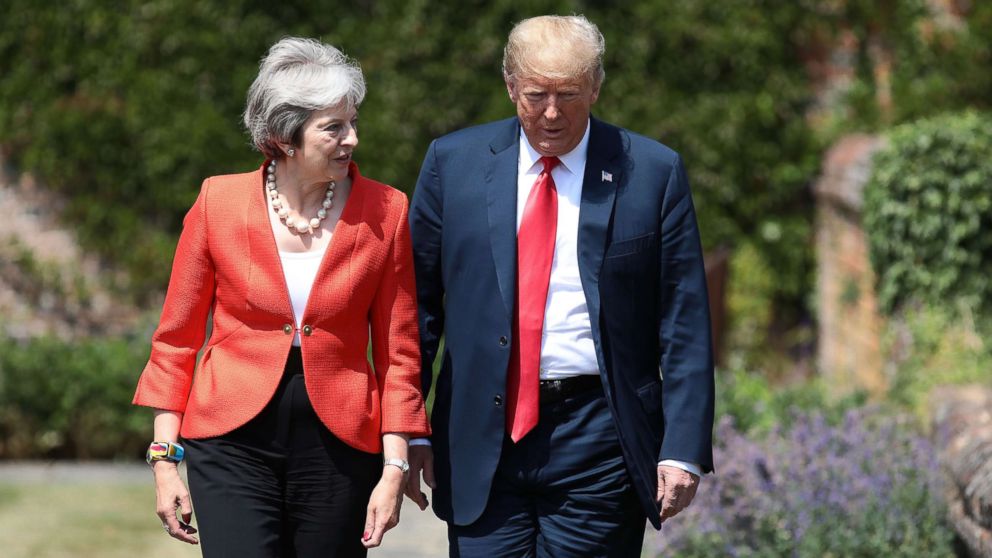 PHOTO: Prime Minister Theresa May walks with President Donald Trump at Chequers, July 13, 2018, in Aylesbury, England.