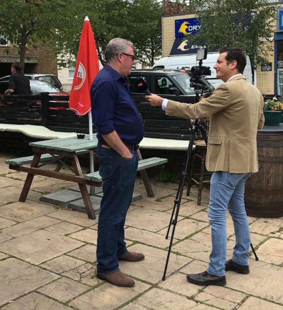 PHOTO: Damien Smyth, the pub landlord, is interviewed by Swiss television has attracted media attention from around the world.