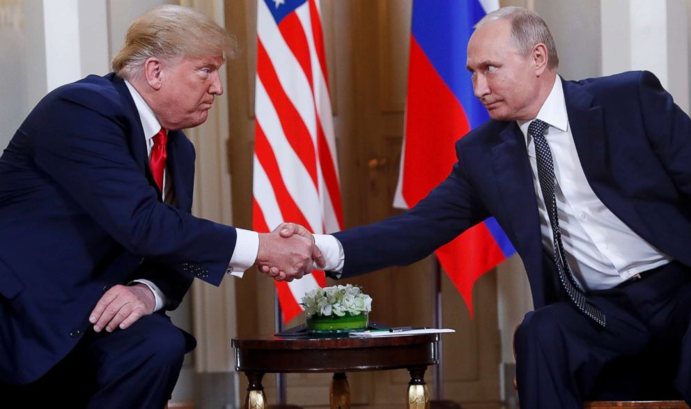 PHOTO: In this July 16, 2018, file photo, President Donald Trump, left, and Russian President Vladimir Putin shake hands at the beginning of a meeting at the Presidential Palace in Helsinki, Finland.