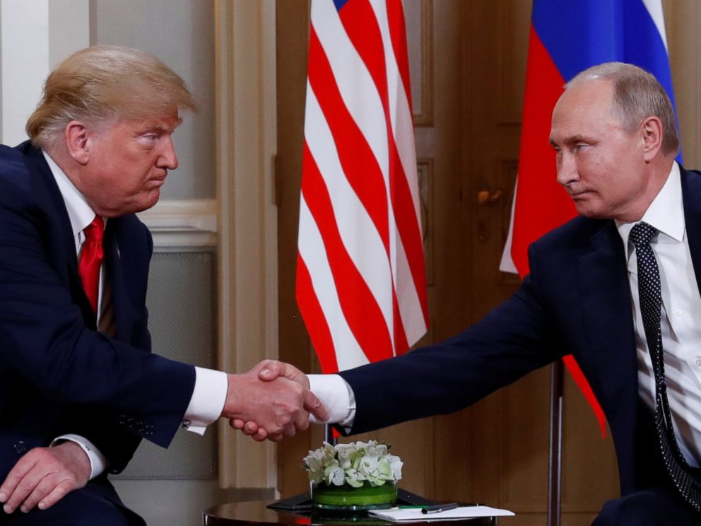 PHOTO: President Donald Trump and Russias President Vladimir Putin shake hands as they meet in Helsinki, Finland, July 16, 2018.