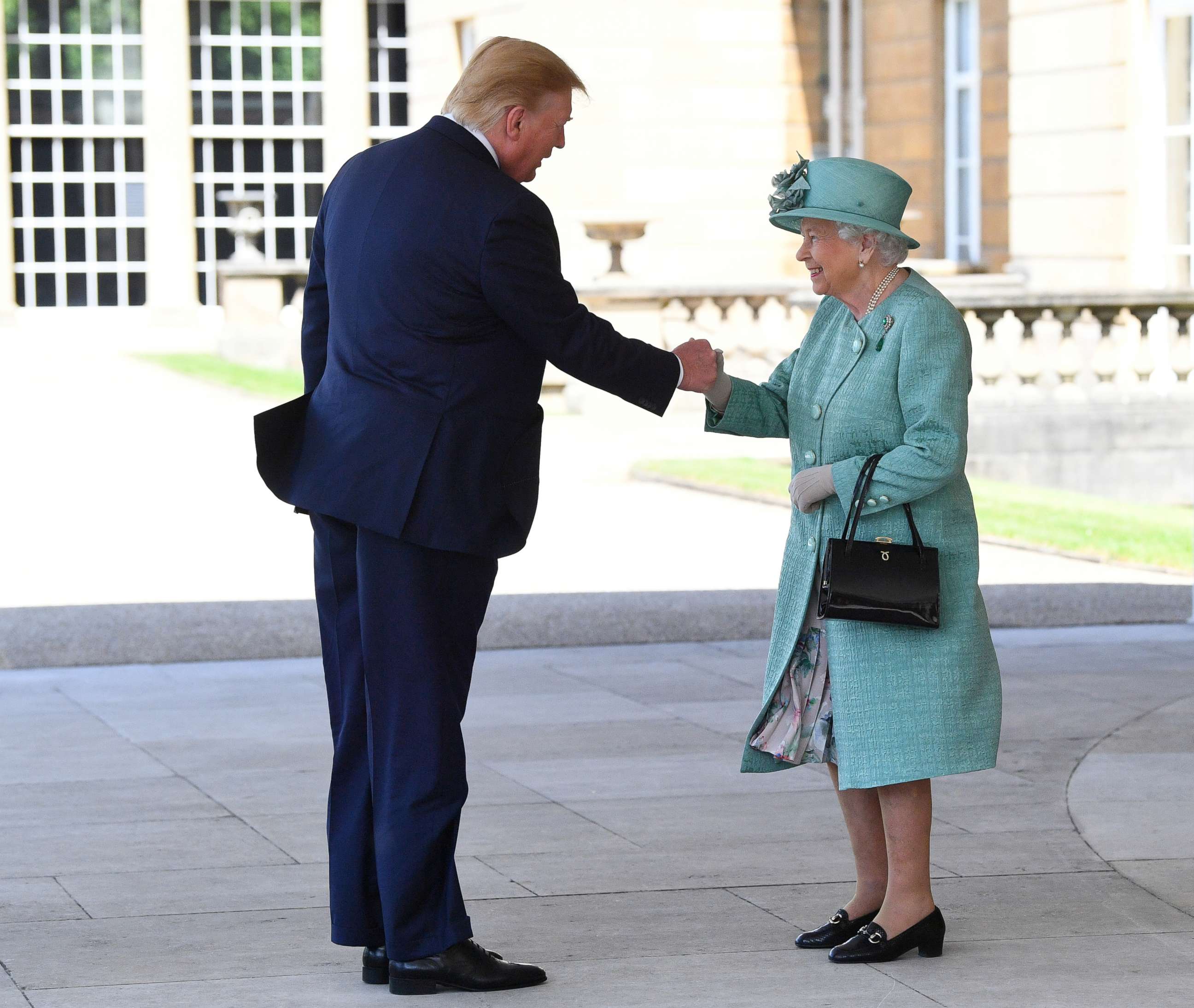 PHOTO: Britain's Queen Elizabeth II greets President Donald Trump as he arrives for the Ceremonial Welcome at Buckingham Palace, in London, June 3, 2019.
