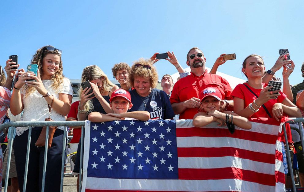 PHOTO: A closely packed crowd of Trump supporters, most without masks, listen to President Donald Trump speak after arriving at Tampa International Airport, on a day when the state of Florida registered 257 new COVID-19 fatalities, July 31, 2020.