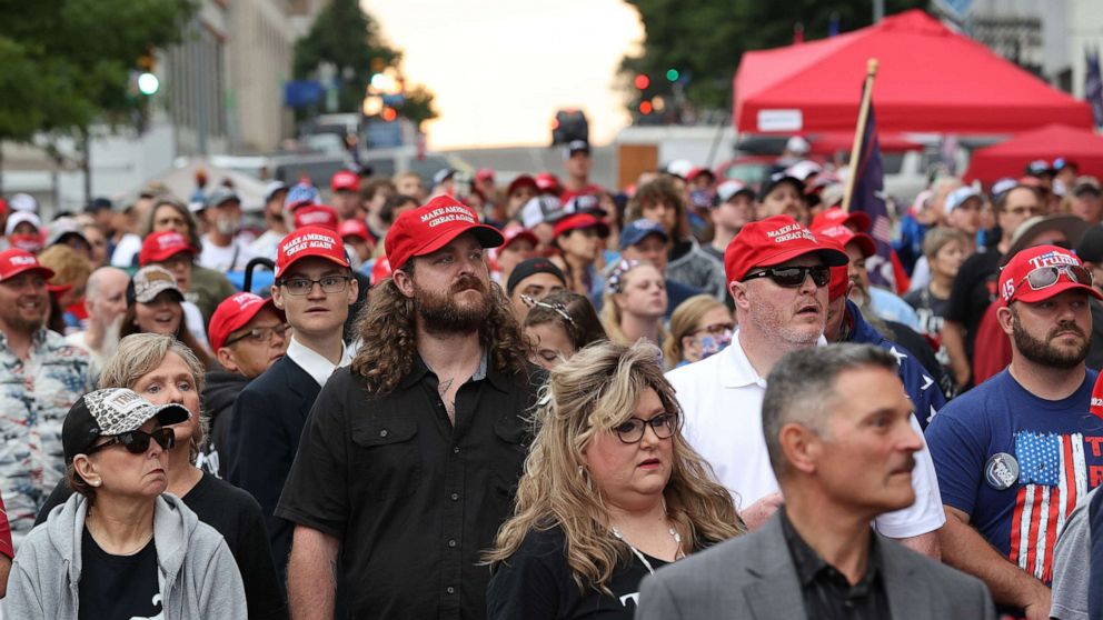 PHOTO: Supporters of President Donald Trump wait to attend his campaign rally at the BOK Center, June 20, 2020, in Tulsa, Okla.