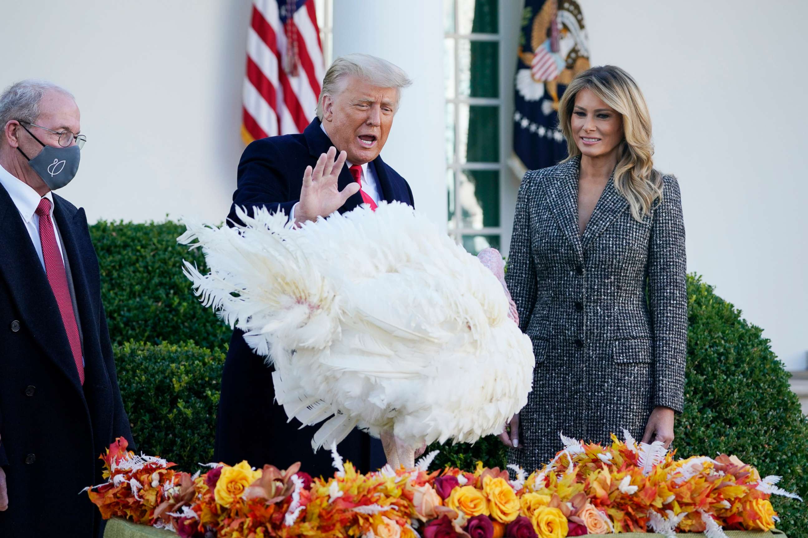 PHOTO: President Donald Trump pardons Corn, the national Thanksgiving turkey, in the Rose Garden of the White House, Nov. 24, 2020, in Washington, as first lady Melania Trump and National Turkey Federation Chairman Ron Kardel of Walcott, Iowa, look on.