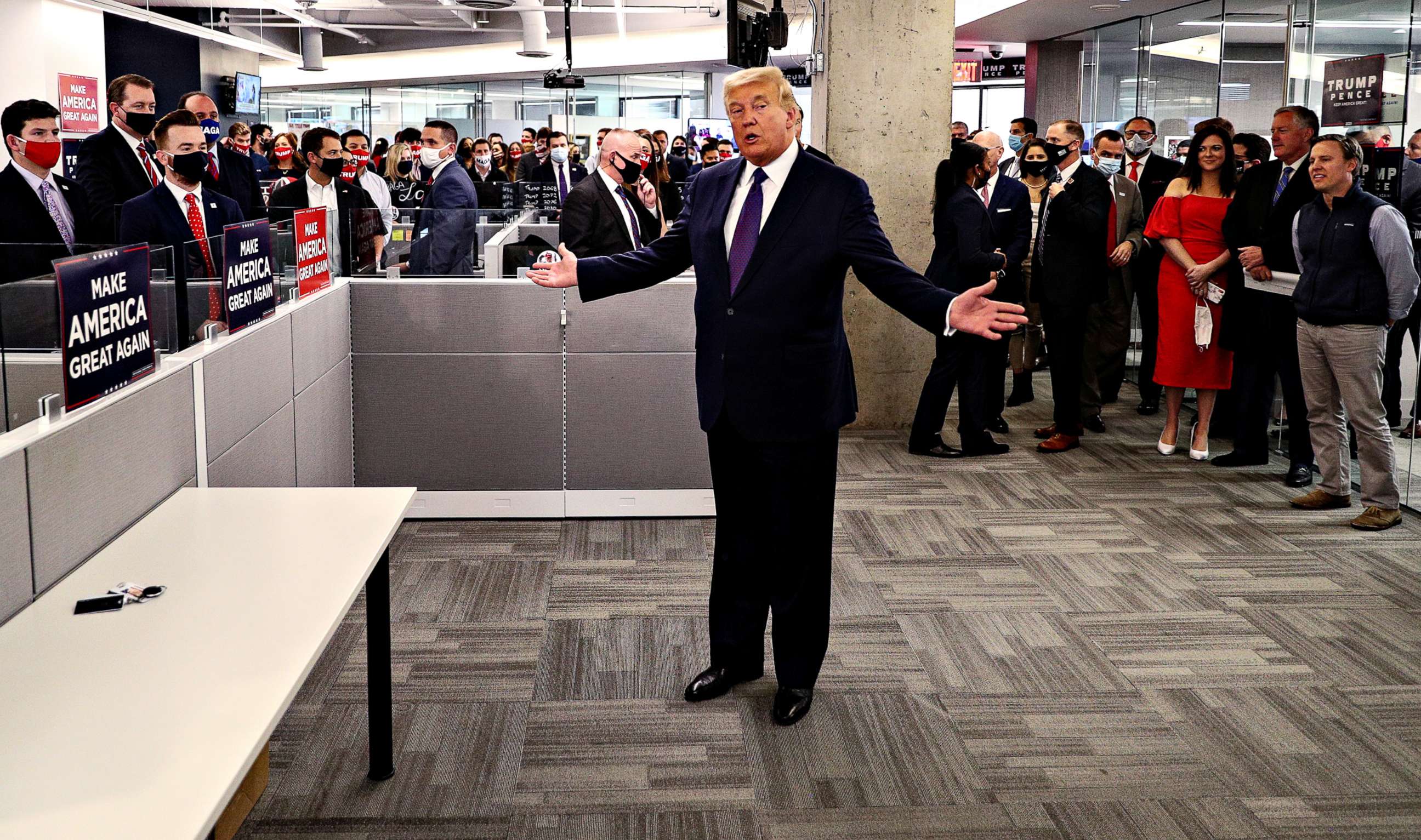 PHOTO: President Donald Trump greets staff members as he visits his presidential campaign headquarters on Election Day in nearby Arlington, Va., Nov. 3, 2020.