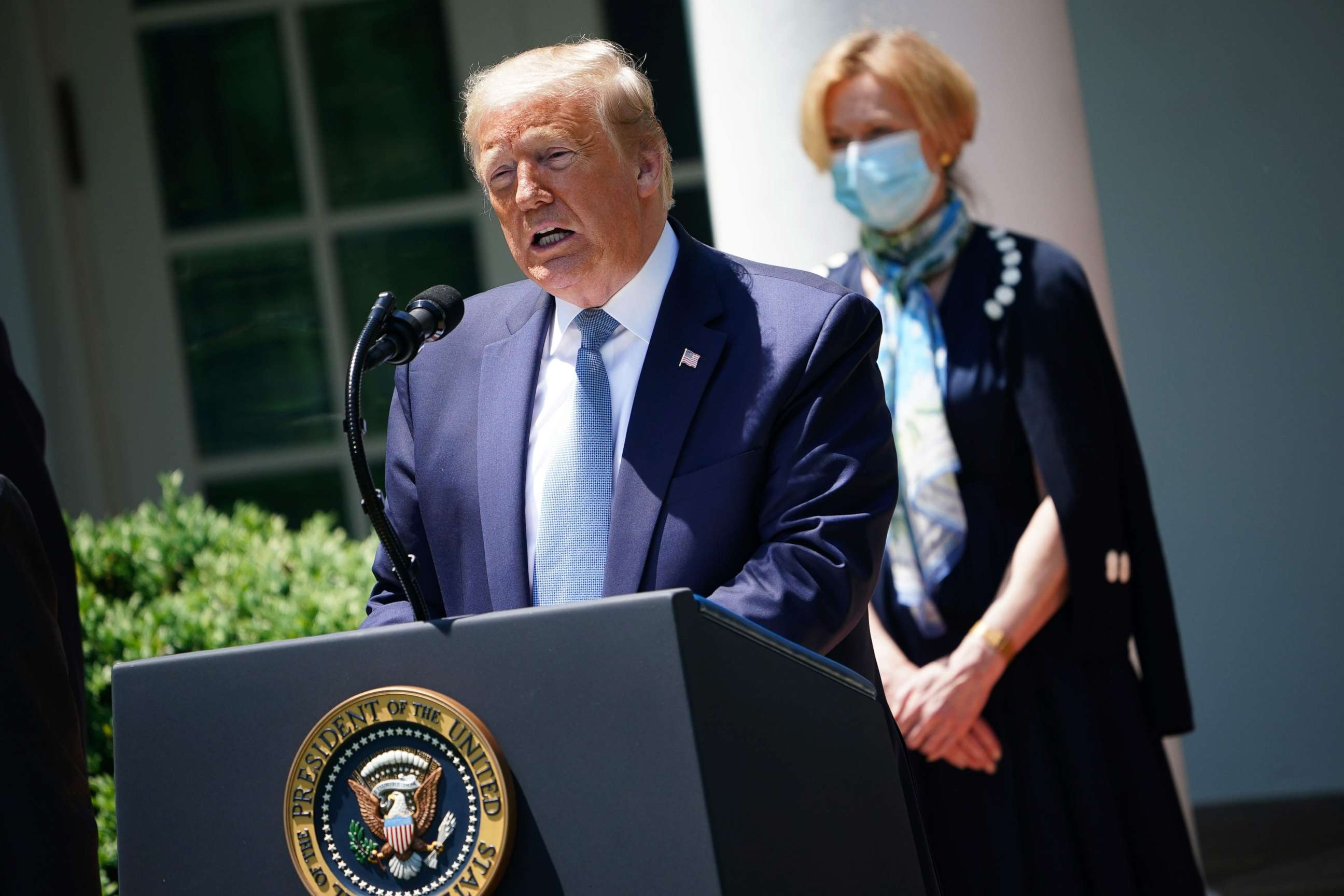 PHOTO: President Donald Trump, with Response coordinator for White House Coronavirus Task Force Deborah Birx, speaks about vaccine development, on May 15, 2020, in the Rose Garden of the White House, in Washington.