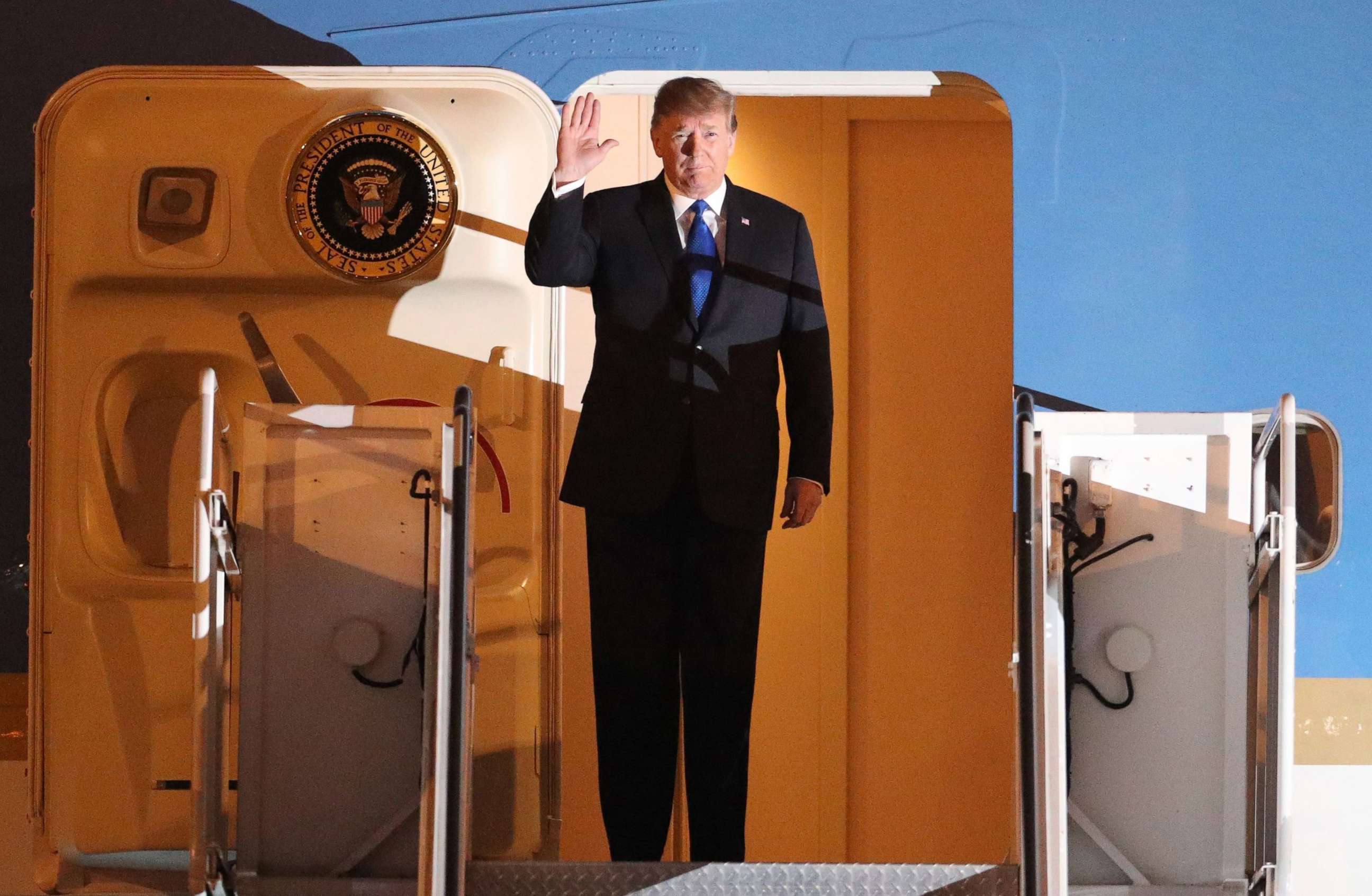 PHOTO: President Donald Trump waves after arriving at Noi Bai airport for the US-DPRK summit in Hanoi, Feb. 26, 2019.