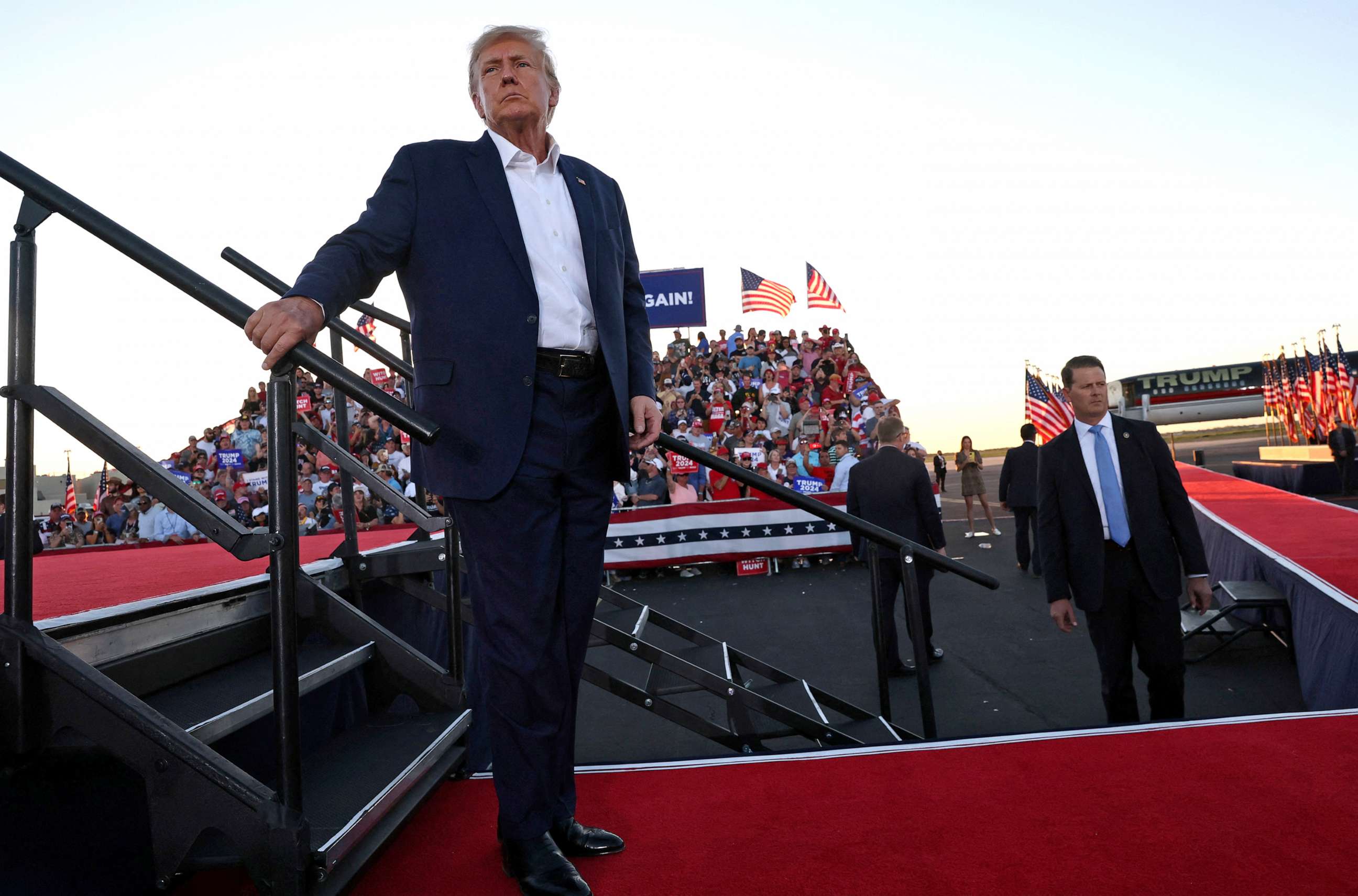 PHOTO: President Donald Trump looks on after concluding his speech during the first rally for his re-election campaign at Waco Regional Airport in Waco, Texas, U.S., March 25, 2023. REUTERS/Leah Millis