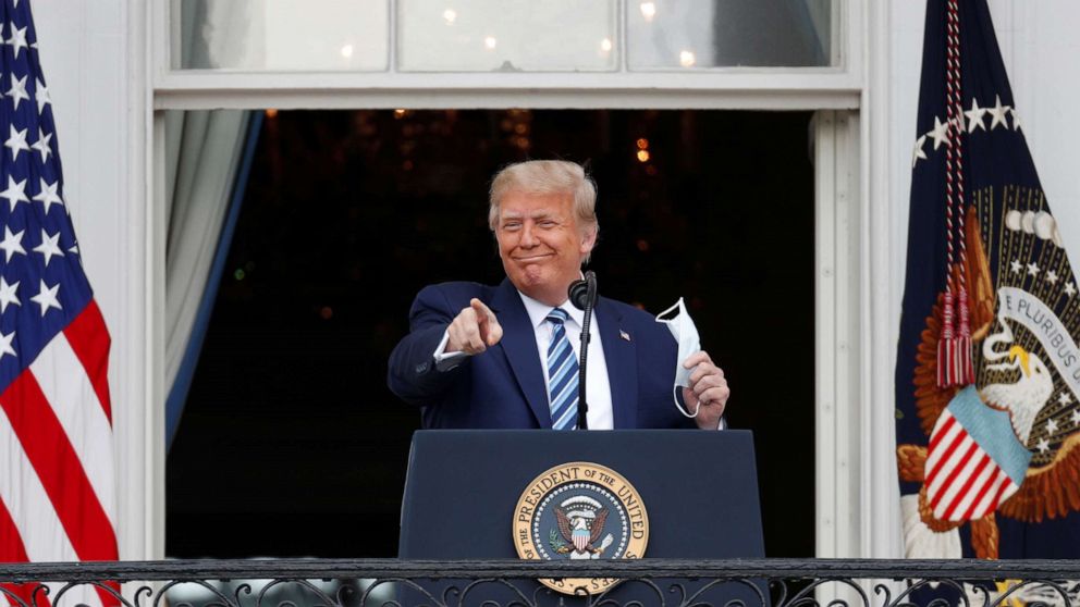 PHOTO: President Donald Trump gestures as he stands on a White House balcony speaking to supporters gathered on the South Lawn for a campaign rally that the White House is calling a "peaceful protest" in Washington, Oct. 10, 2020.